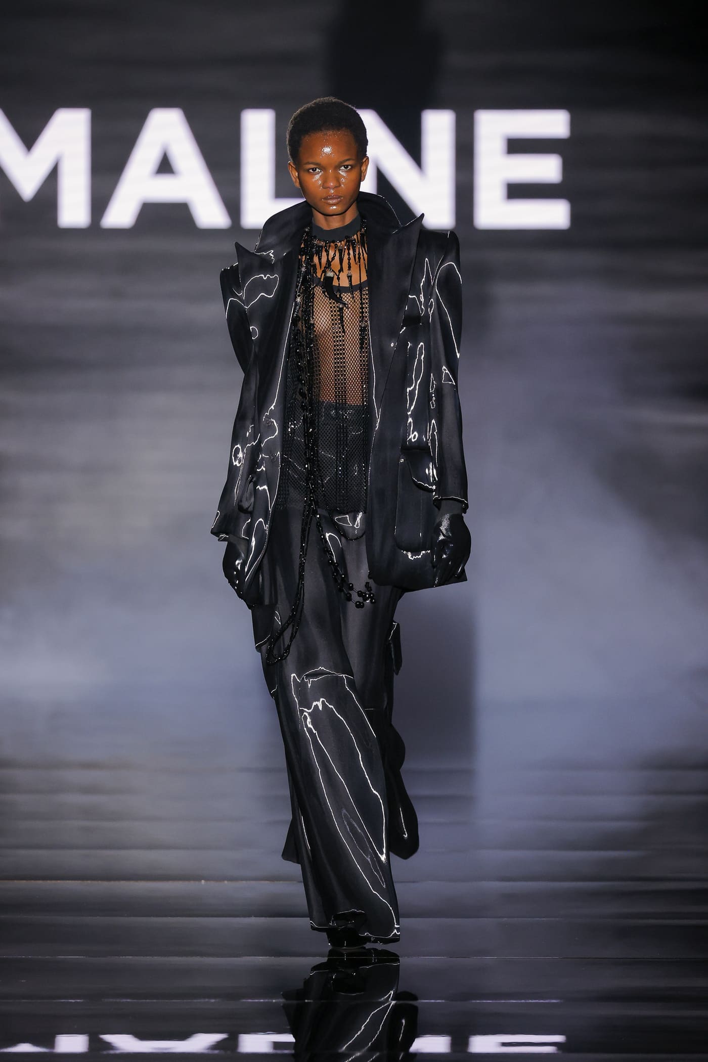 all-black catwalk model with silver stripes
