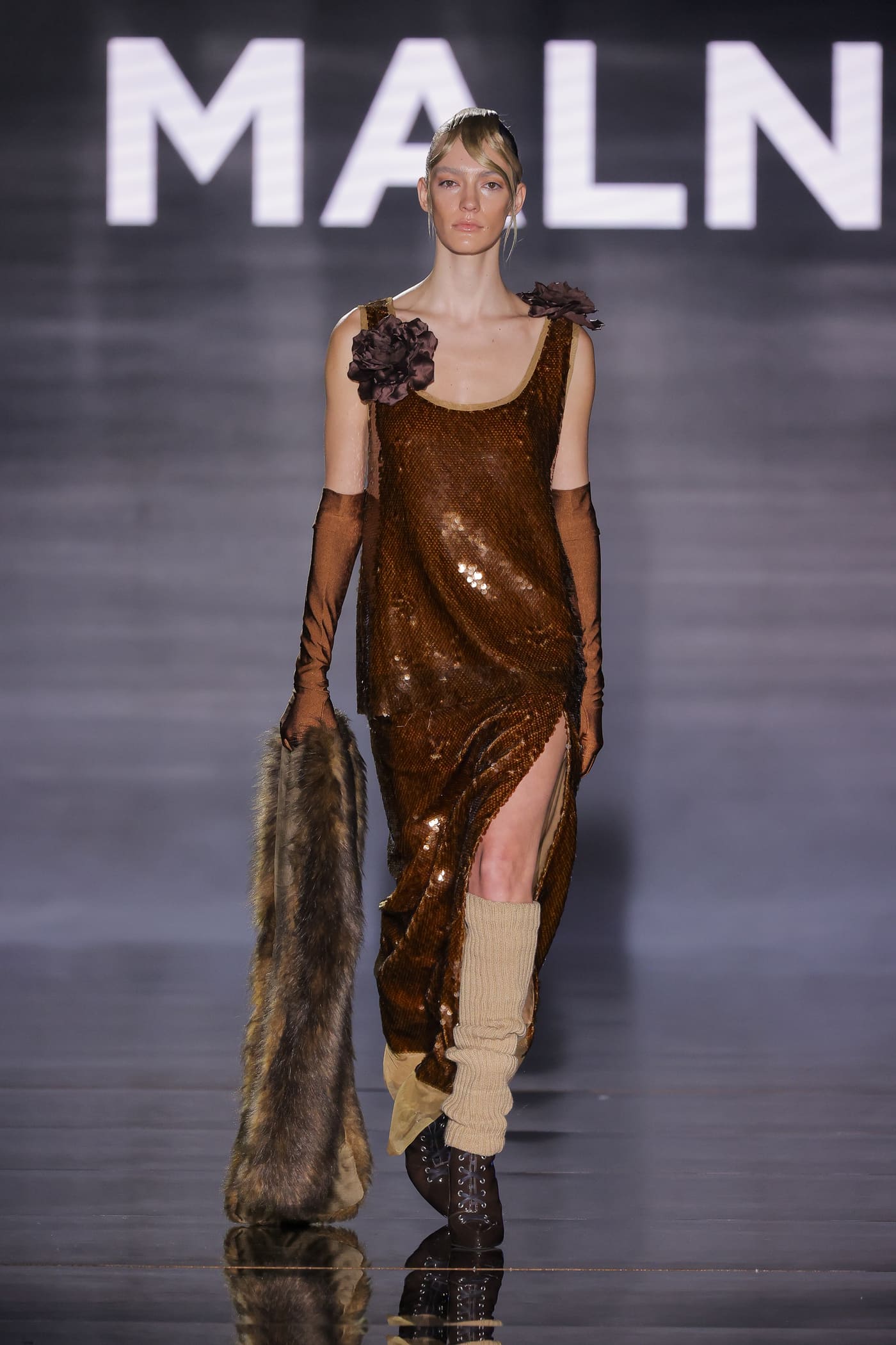 catwalk model in gold dress