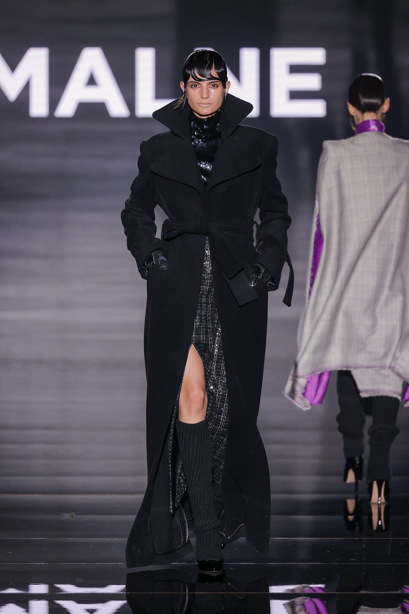 catwalk model in black gabardine down to the feet