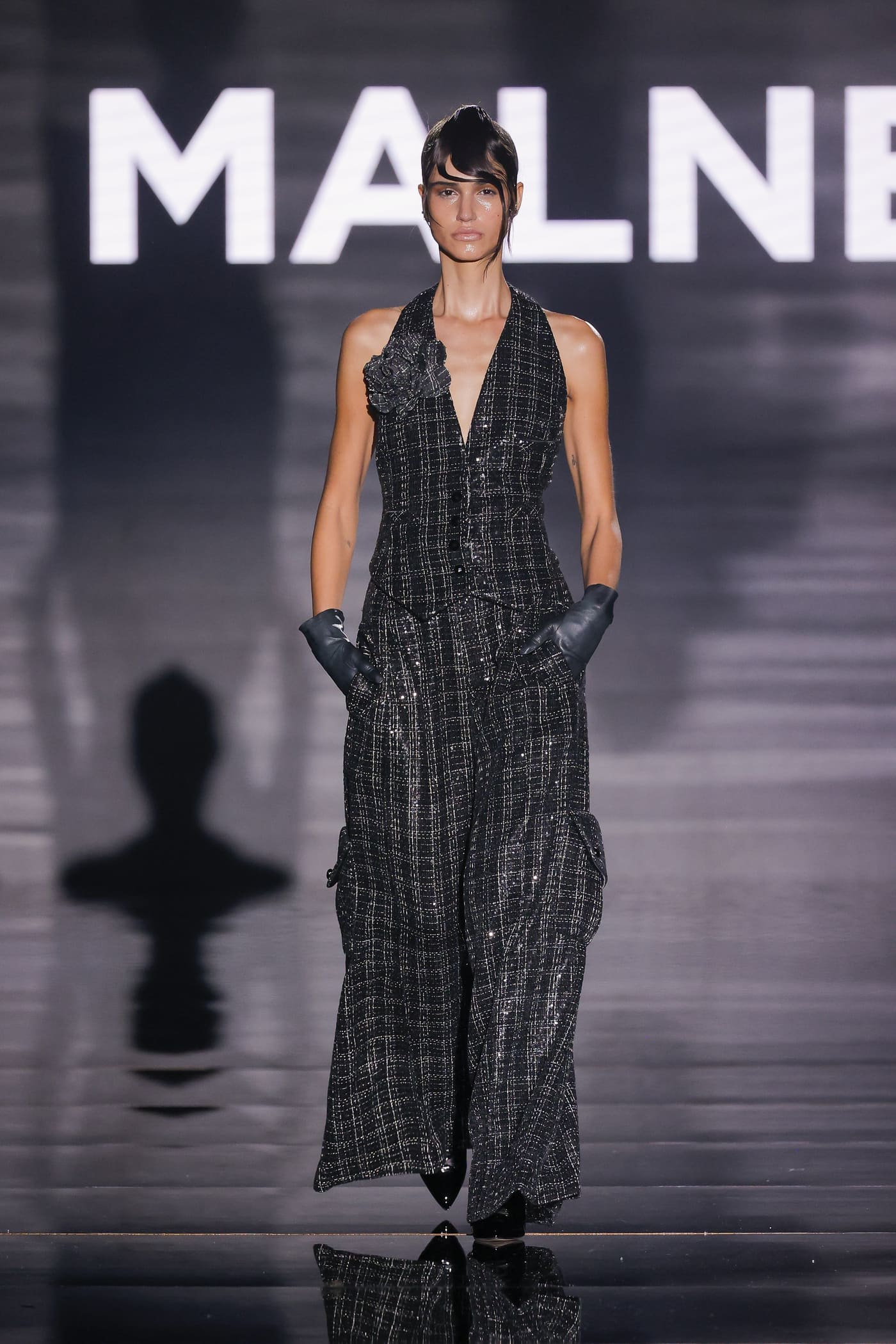catwalk model in a black and white striped dress