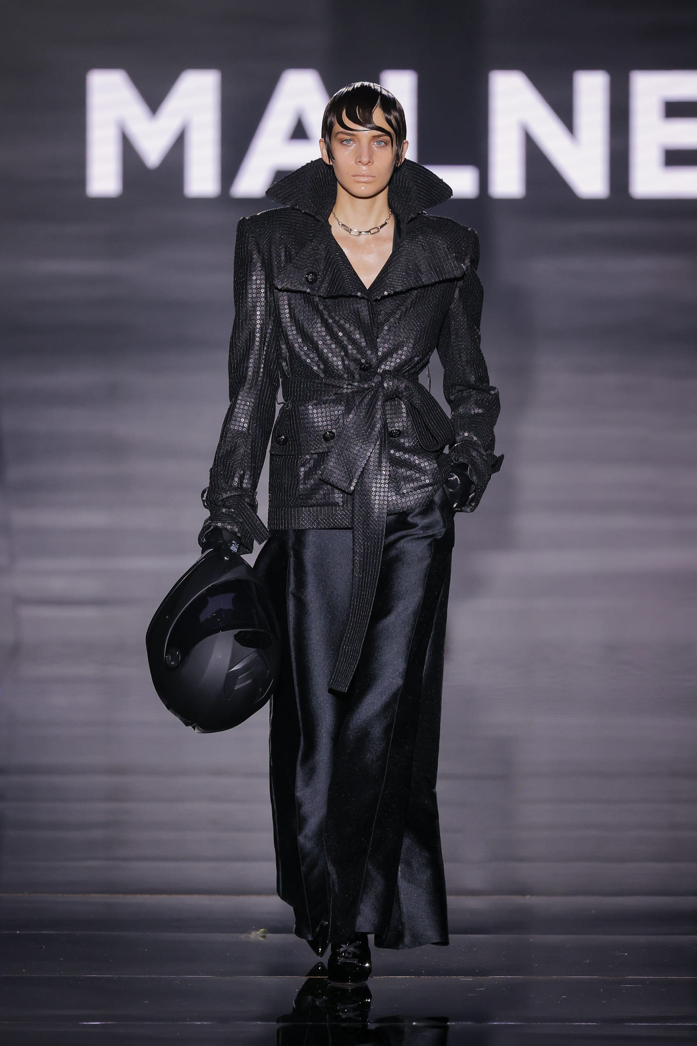 catwalk model apparently for motorbike use, all in black