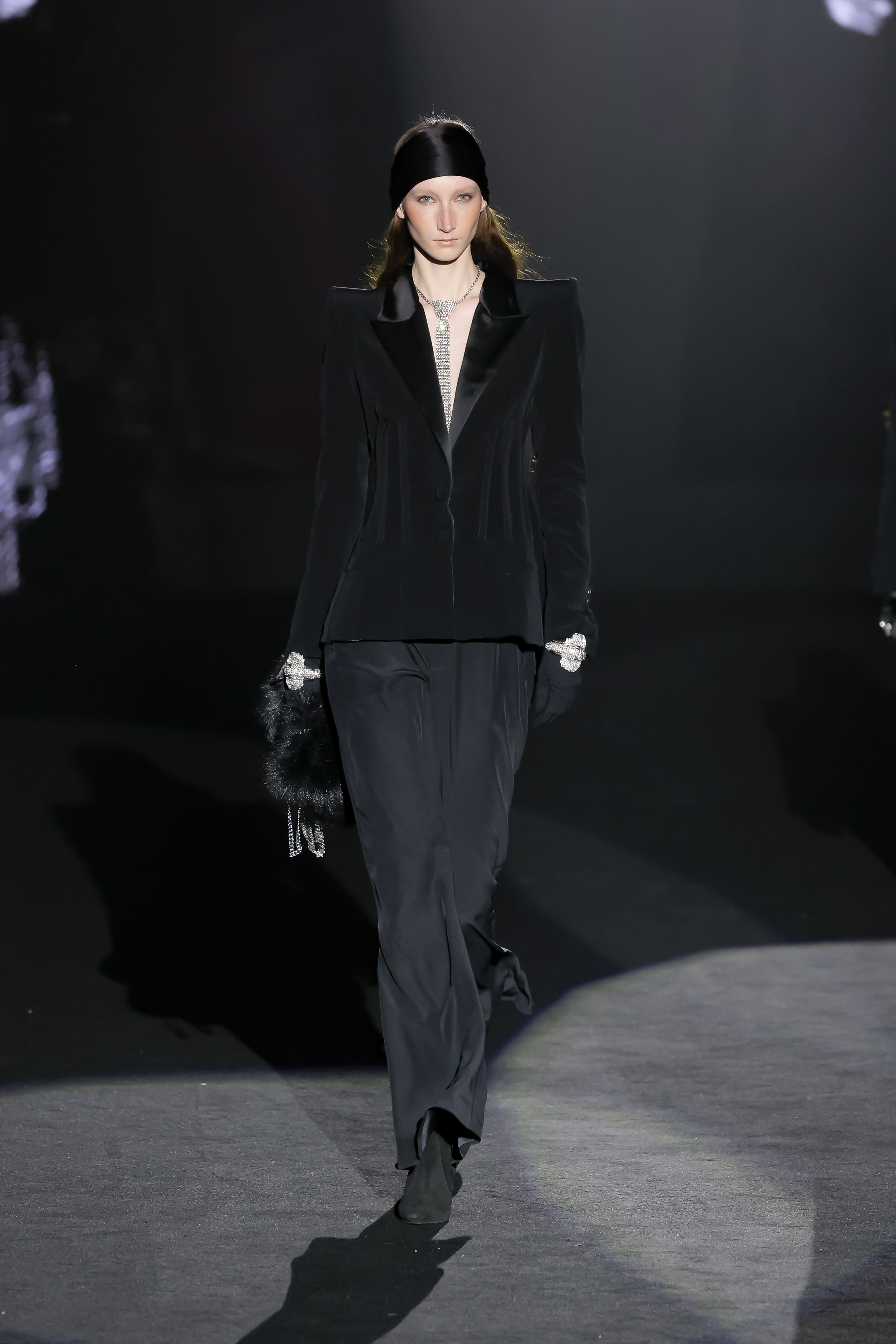 runway look projects a dark sophistication with echoes of androgynous elegance and cinematic mystery