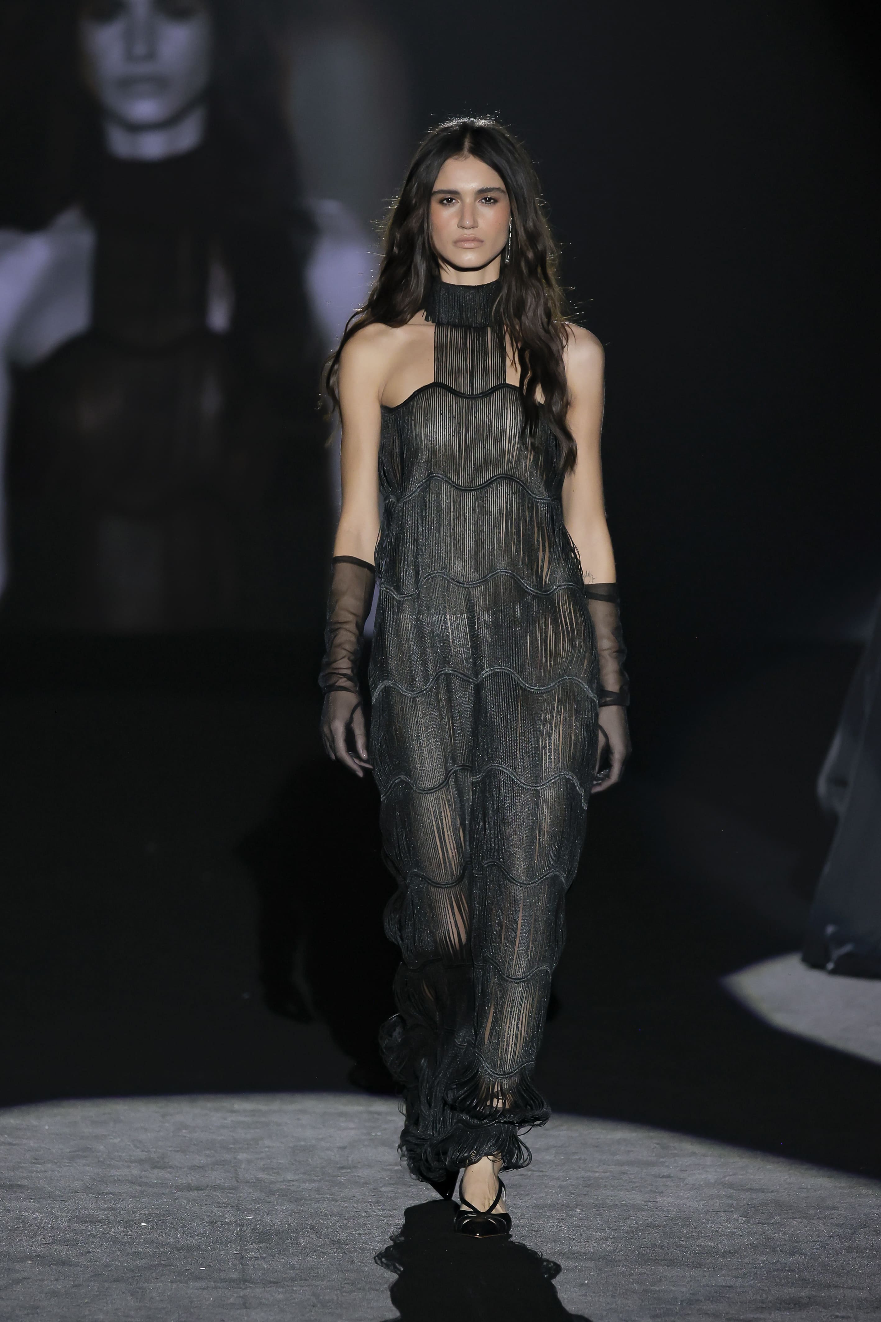 catwalk look embodies a dark, avant-garde elegance with strong stage presence