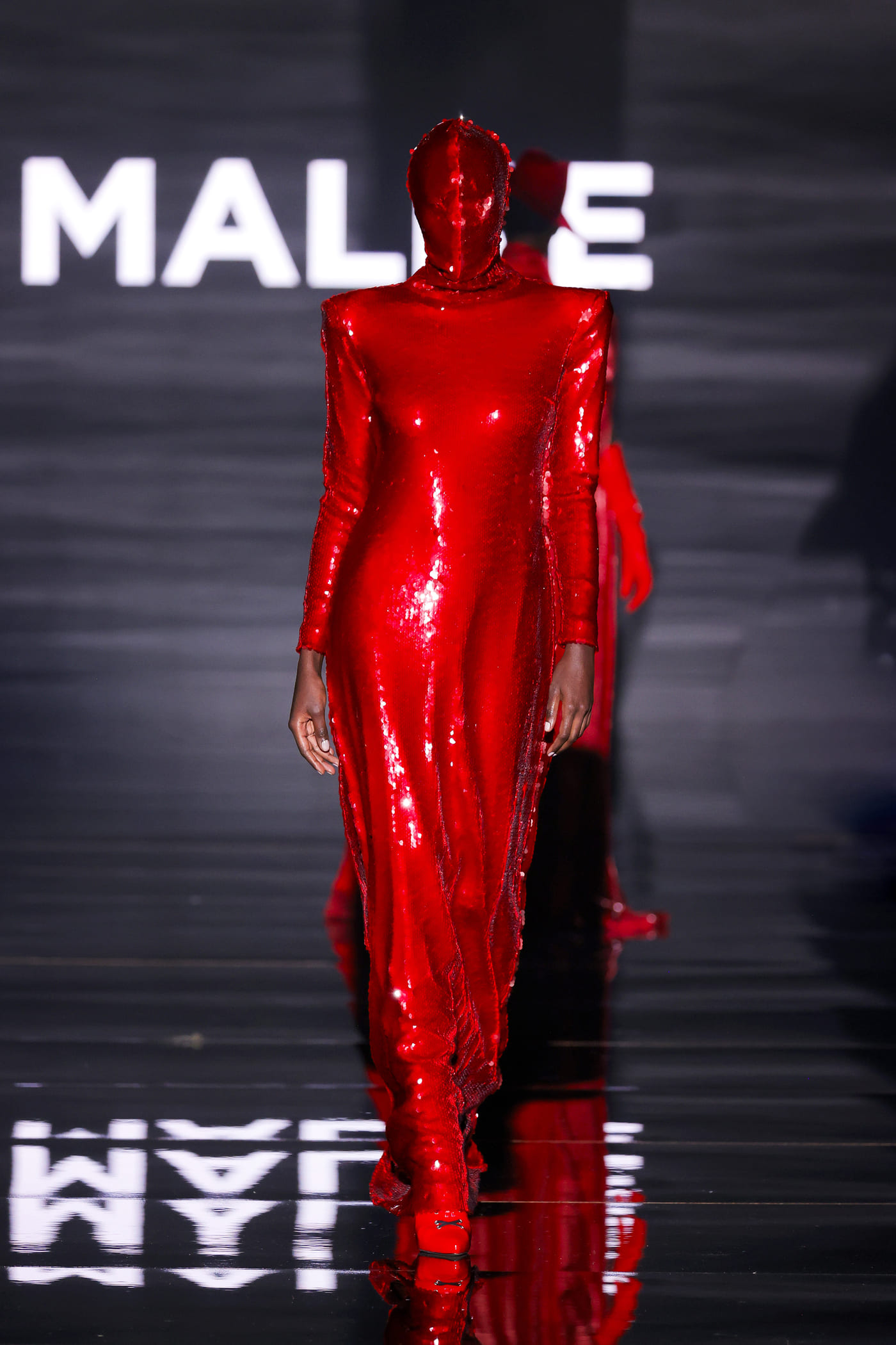 catwalk model with a red face covered up