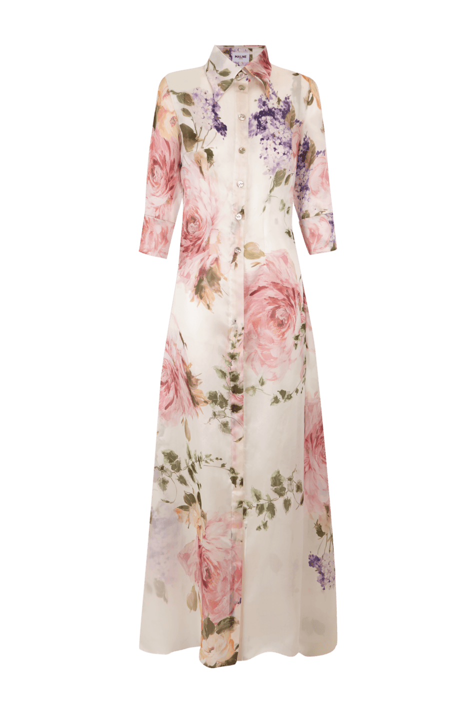 Vestido camisero largo de organza de seda con estampado floral en tonos rosa y lila. Tiene manga tres cuartos, cierre frontal con botones y silueta fluida que aporta un aire romántico y elegante.
